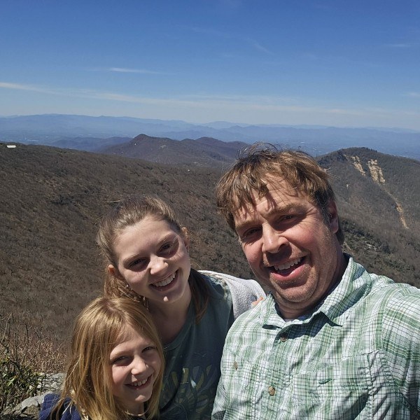 Daniel and his kids on a Blue Ridge mountain summit